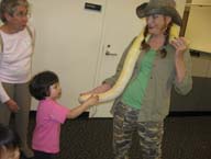 Petting the snake at the Google Halloween party