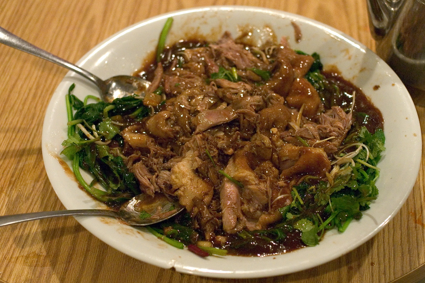 Duck braised in wine, with cilantro and spinach