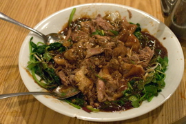 Duck braised in wine, with cilantro and spinach
